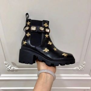 black boots with bees and stars